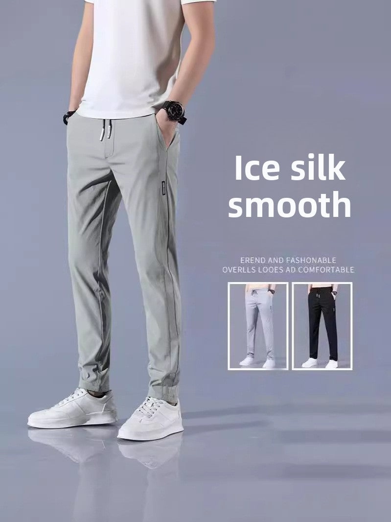 Person wearing light gray pants with text 'Ice silk smooth' on a gray background